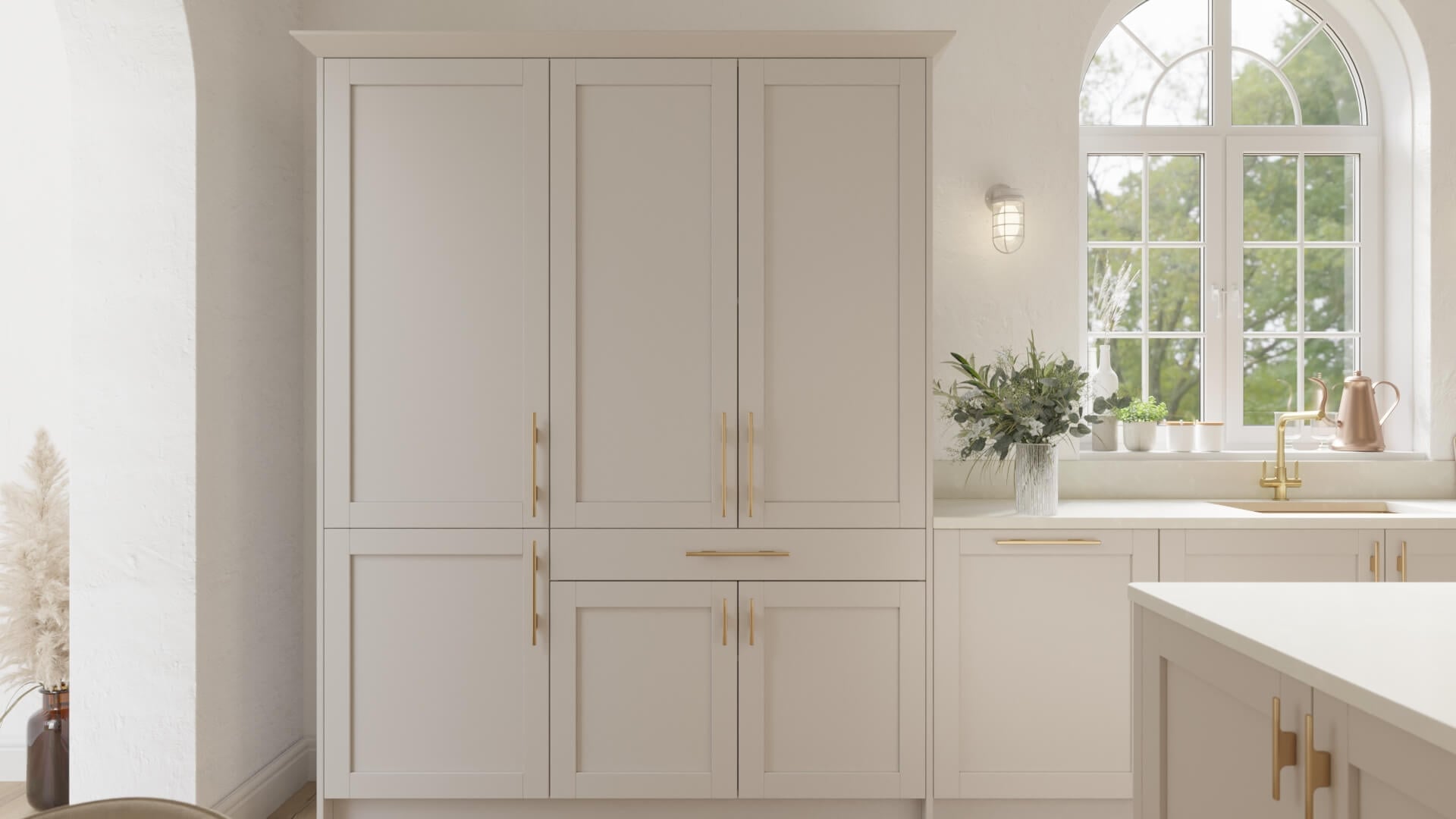 Slim smooth shaker kitchen design in a warm neutral shade (clay), styled with a white quartz worktop, and brass gold bar handles in our 'true' range.